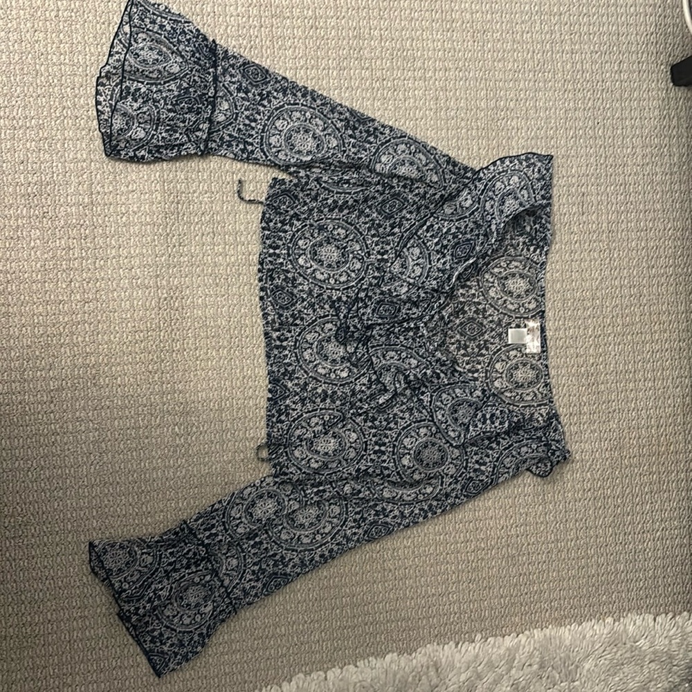 Long sleeve flowy shirt. Brand is Band of Gypsies. Size S. Color blue